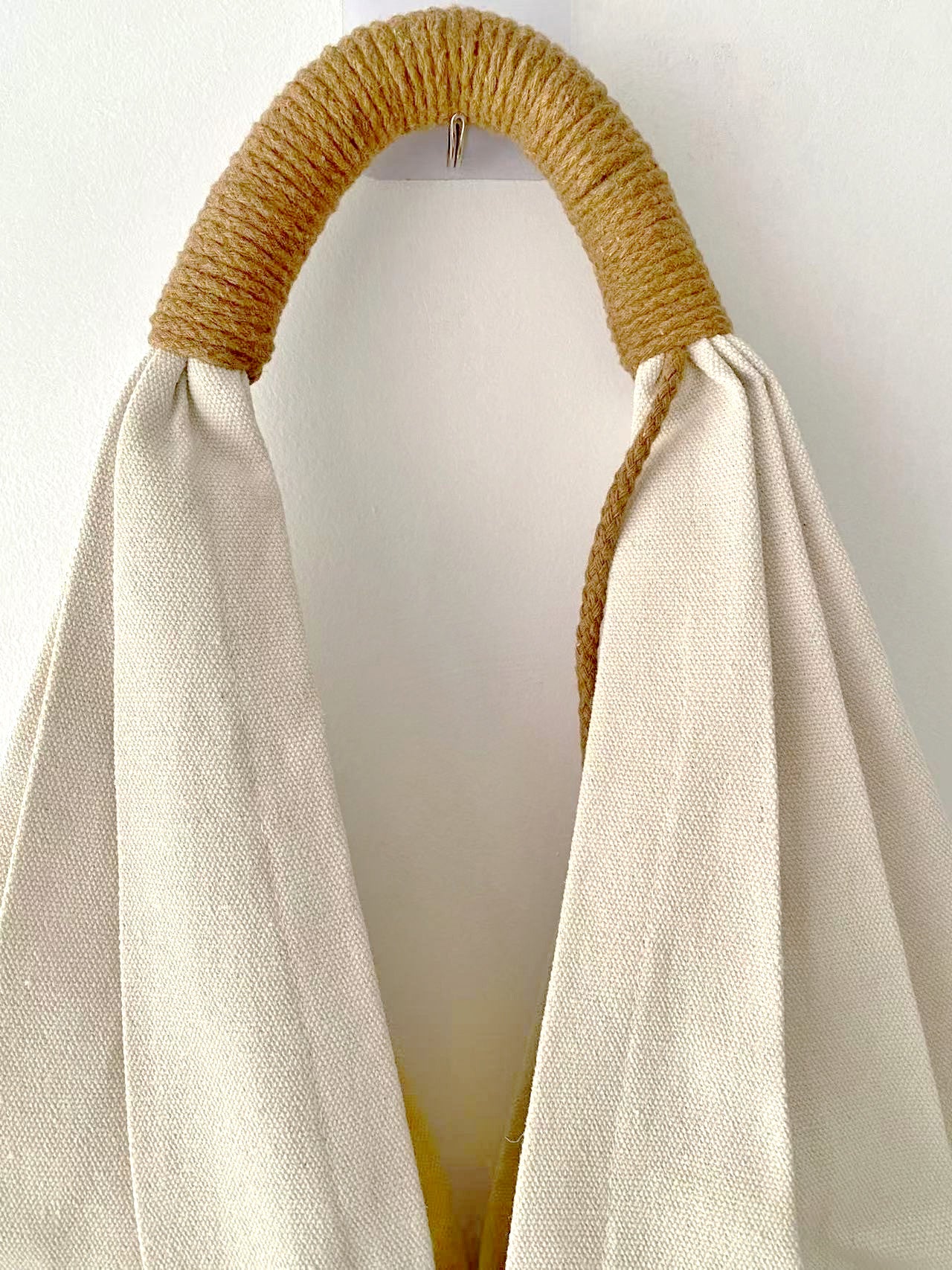 Spacious canvas shoulder bag with unique floral embroidery for daily use.