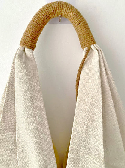 Spacious canvas shoulder bag with unique floral embroidery for daily use.