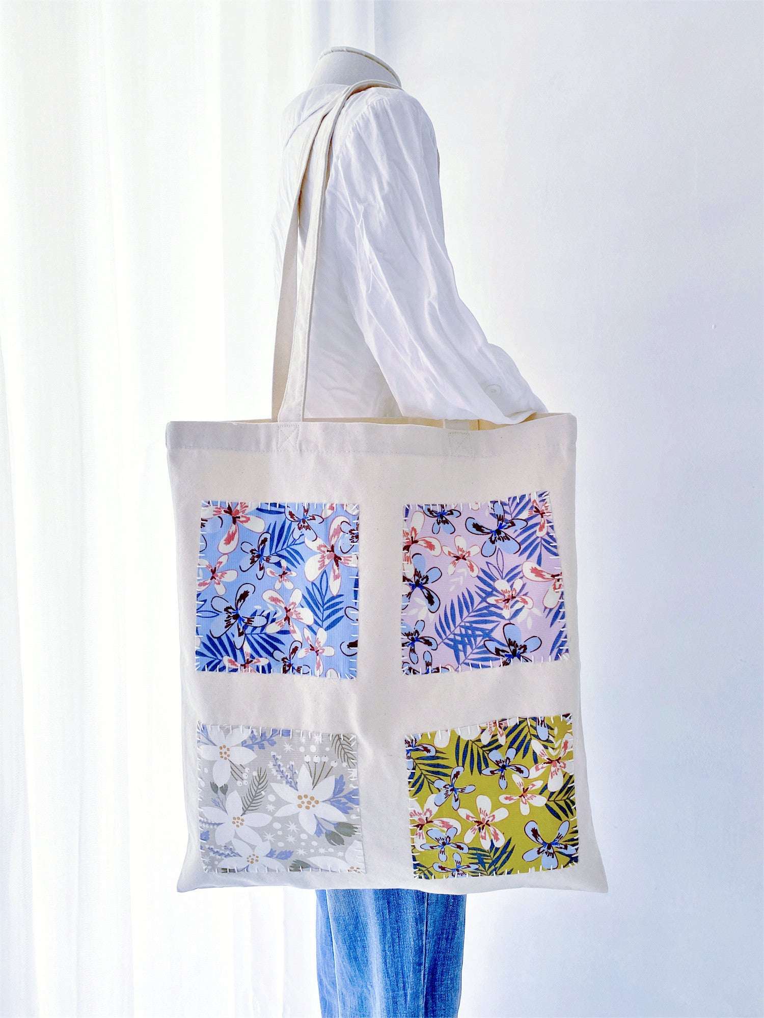 This isn't just a durable canvas tote; it's a piece of wearable art that makes me feel like I’m carrying a bit of sunshine and human touch on my morning commute.