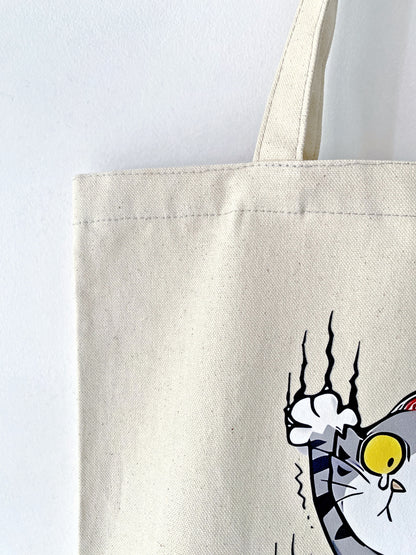 Breathable cotton canvas tote holding a yoga mat and water bottle