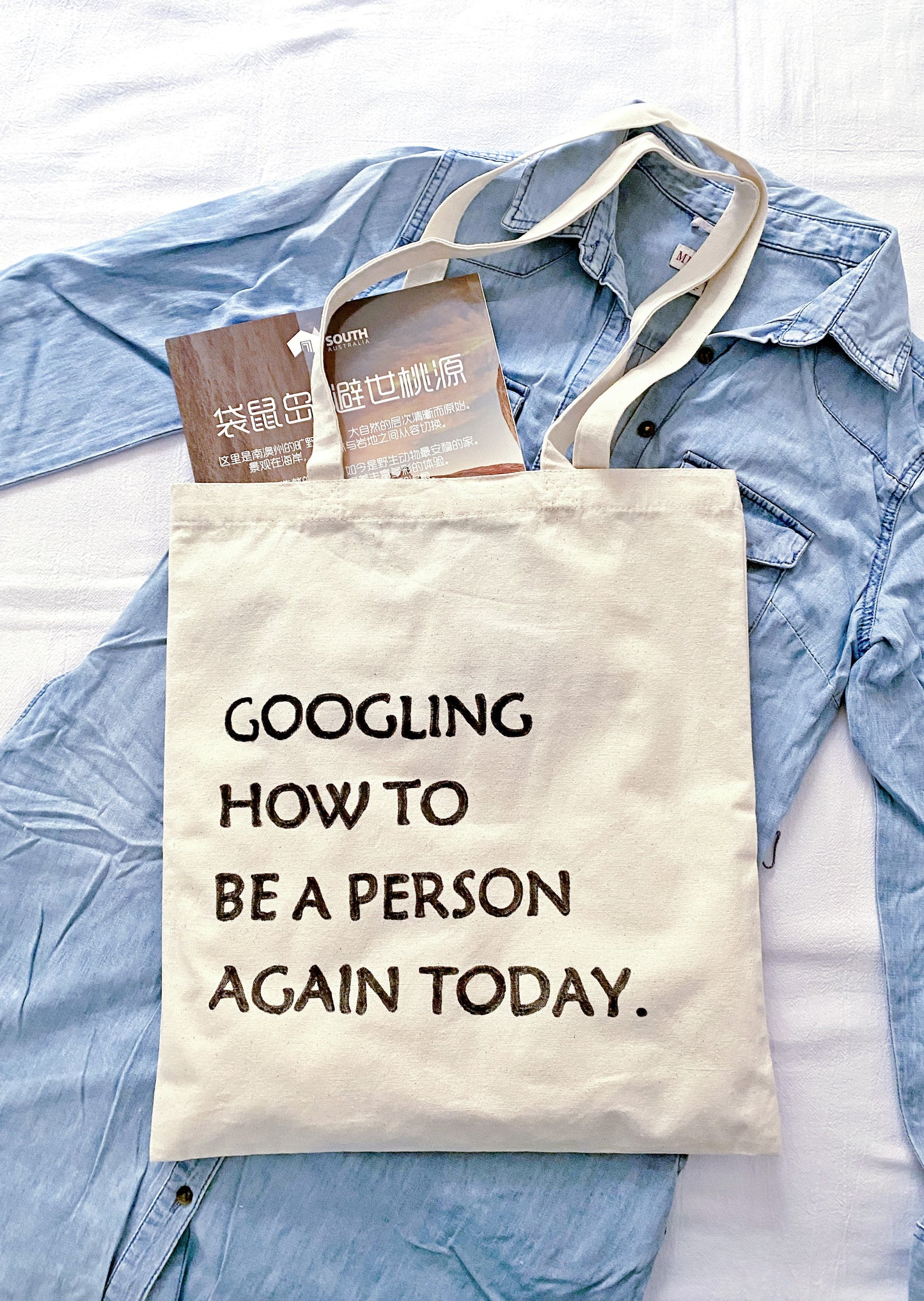 Sustainable canvas bag with a personal touch perfect for slow living enthusiasts and book lovers.