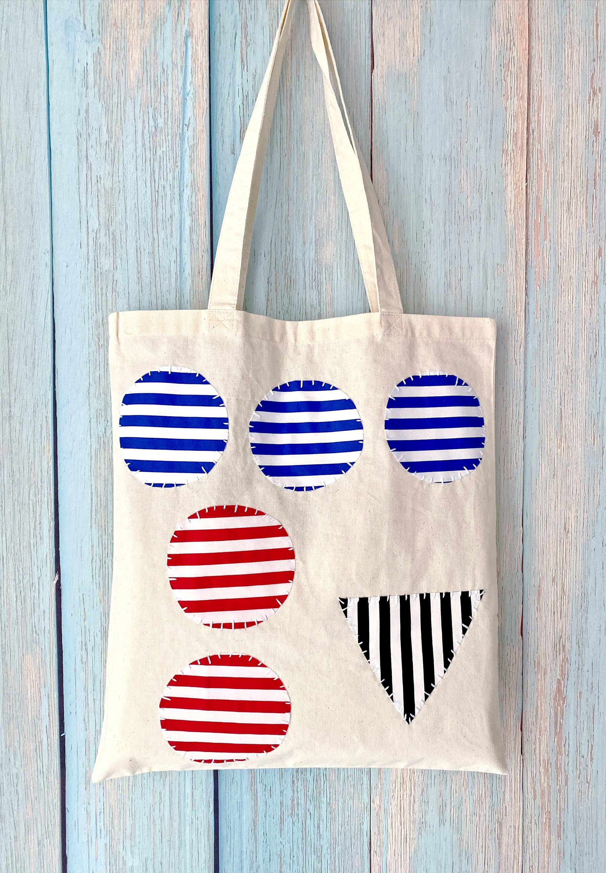 Soft cotton fabric tote, perfect for students carrying books and tablets comfortably.