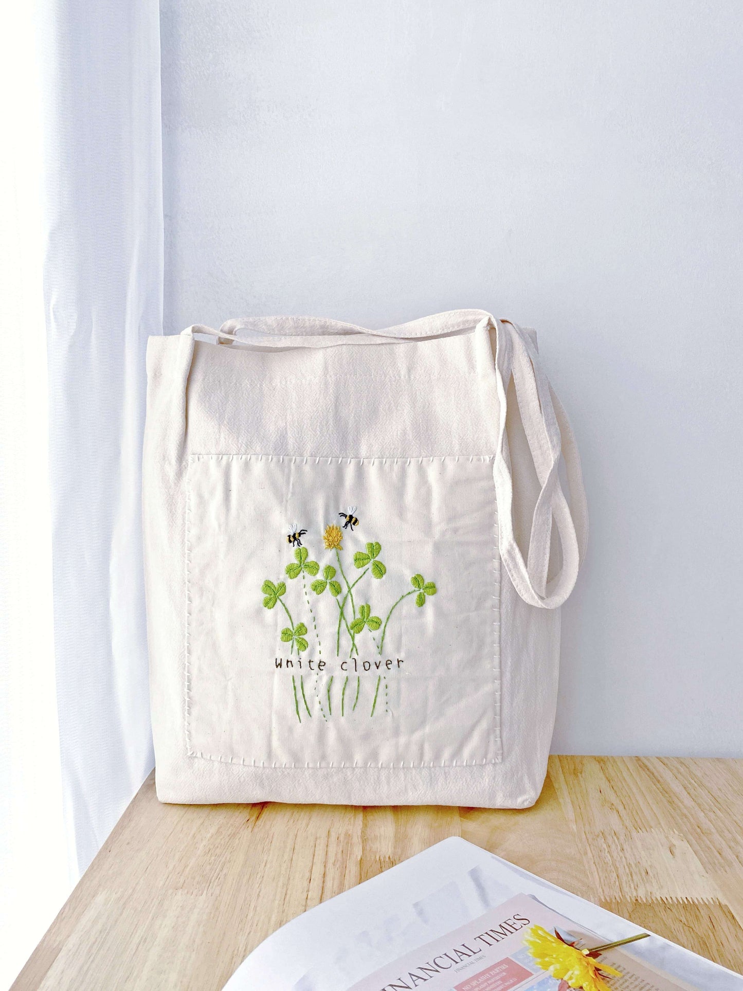 Gift-ready eco tote bag featuring intricate floral embroidery, made from sustainable cotton-linen.