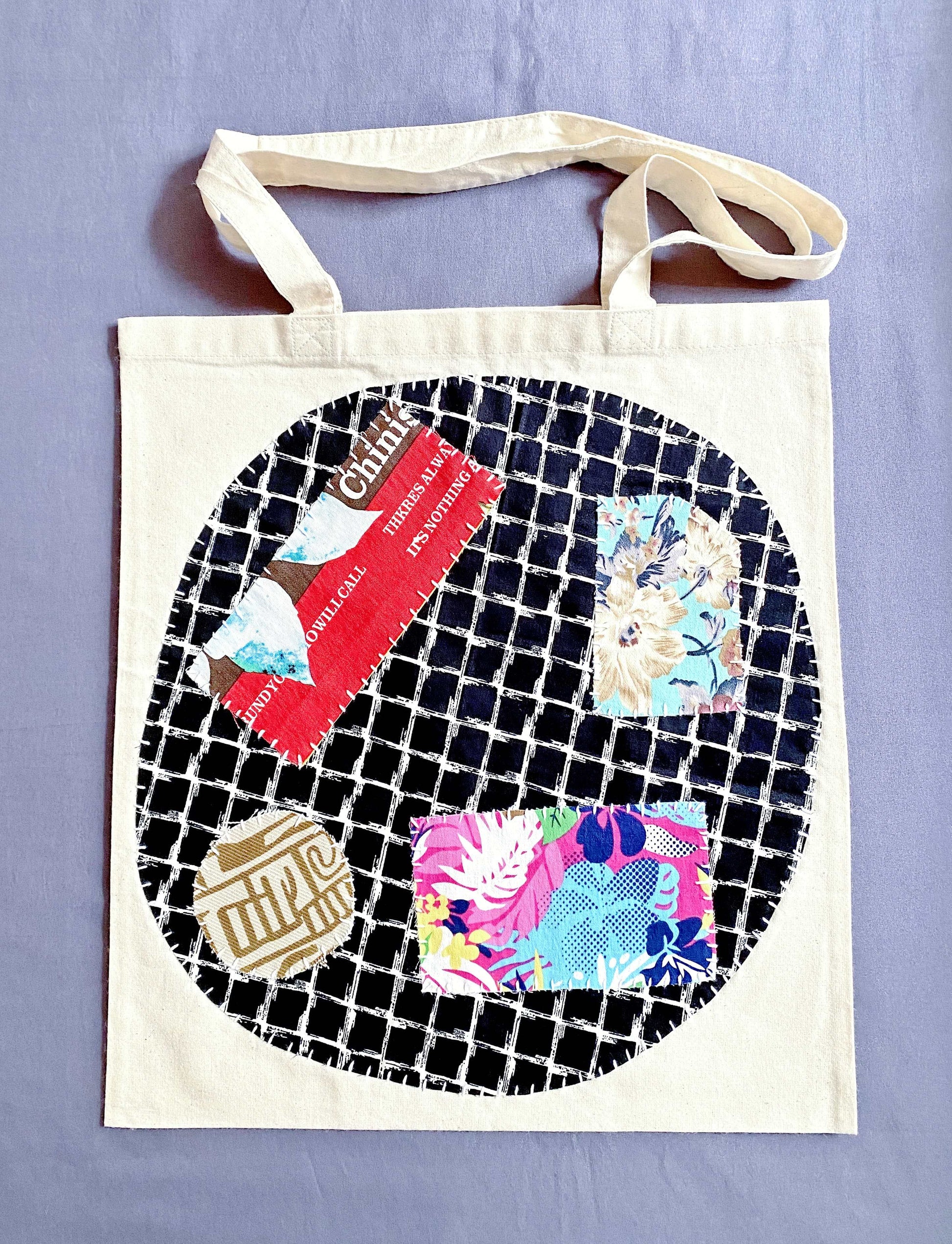 Durable natural canvas tote bag styled with a unique artisanal patchwork design.