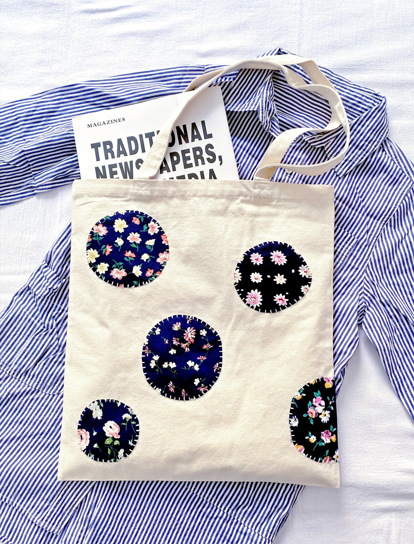 Eco-friendly canvas tote with handcrafted patchwork details for a mindful morning commute.