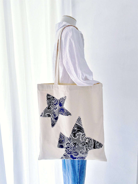 Handcrafted, eco-friendly tote bag featuring patchwork details, ideal for gifting to someone who loves embracing minimalism and sustainability.