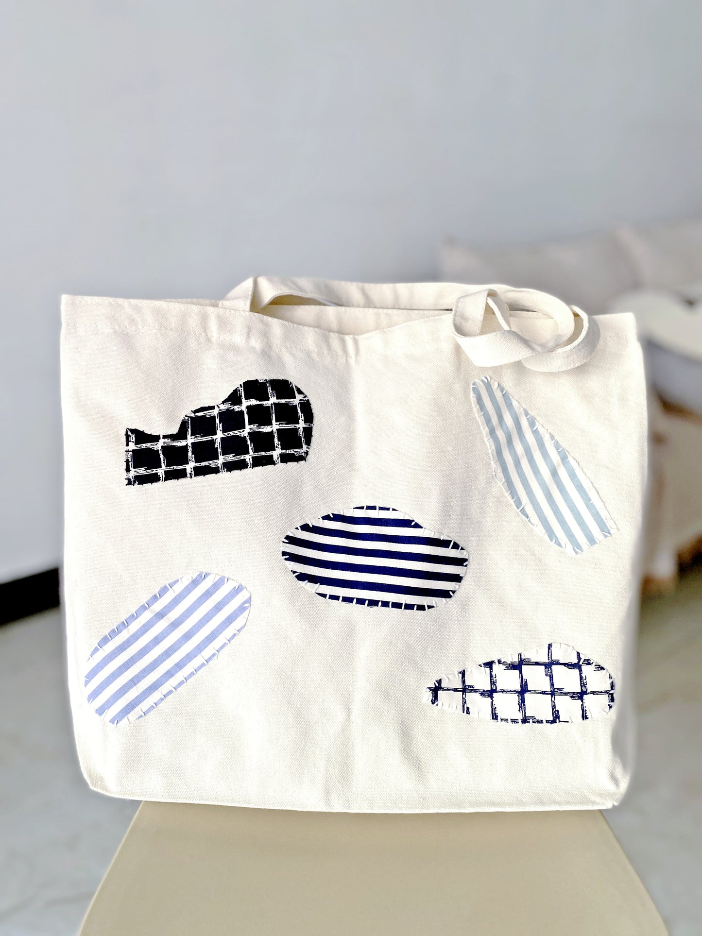 Carry bag positioned as a functional object, not a fashion prop