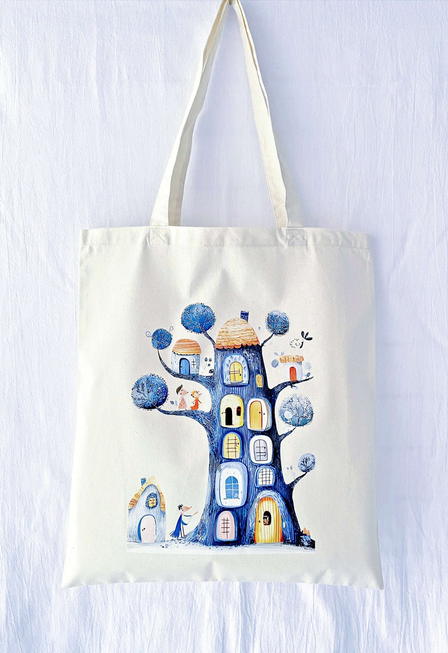 A large capacity, soft cotton tote with a Dream Treehouse design—ideal for keeping your essentials close, whether it's for yourself or a thoughtful gift.