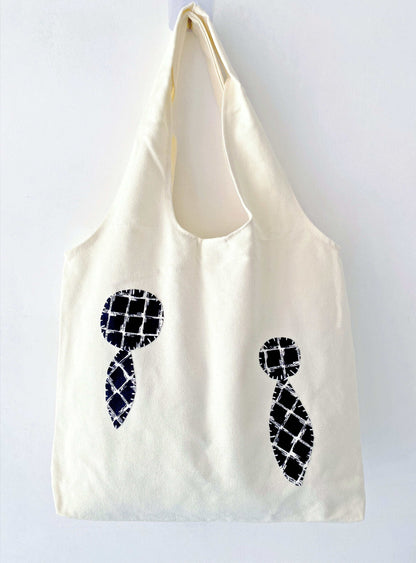 Eco-friendly canvas tote with cheerful stitched patches