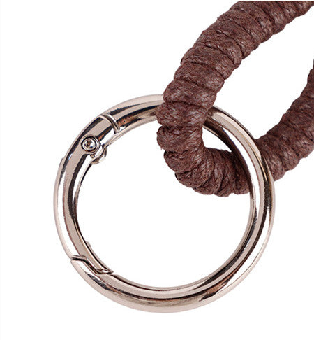 Natural bead keychain accessory shown on a canvas bag