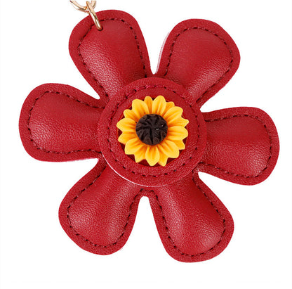Sunflower charm accessory for a simple everyday bag