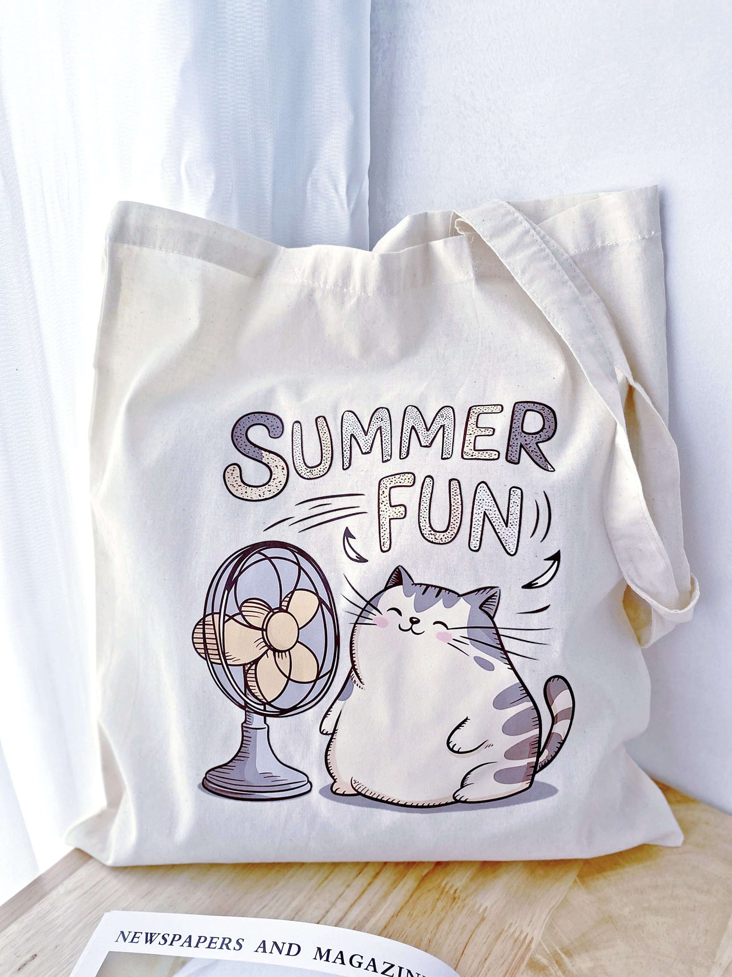 A fun cat print on a soft, large tote – perfect for a cozy weekend outing or as a thoughtful, eco-friendly gift for a friend.