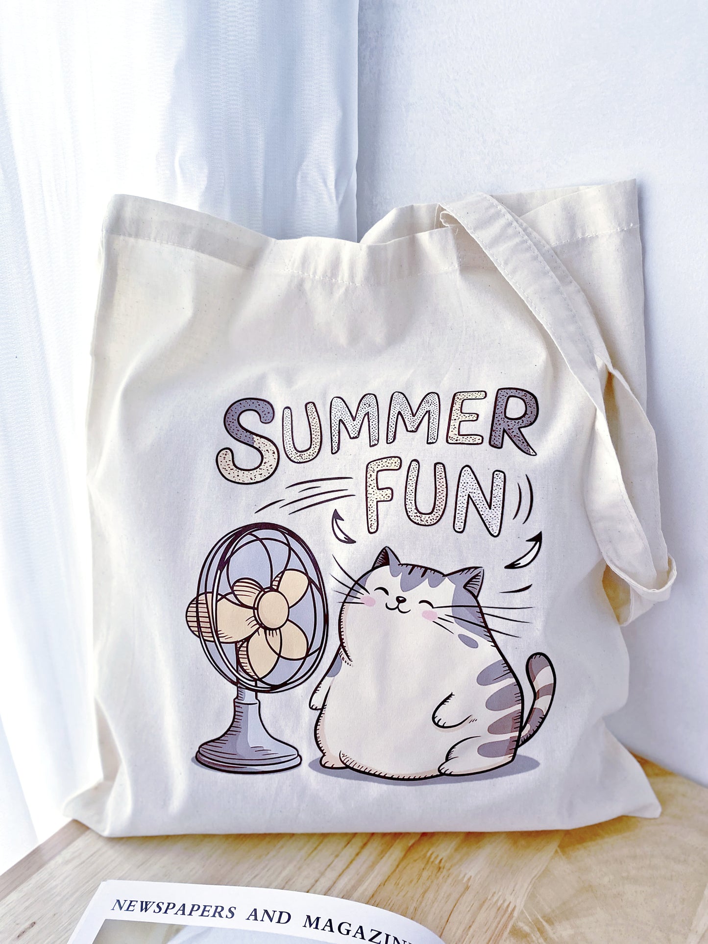 A fun cat print on a soft, large tote – perfect for a cozy weekend outing or as a thoughtful, eco-friendly gift for a friend.