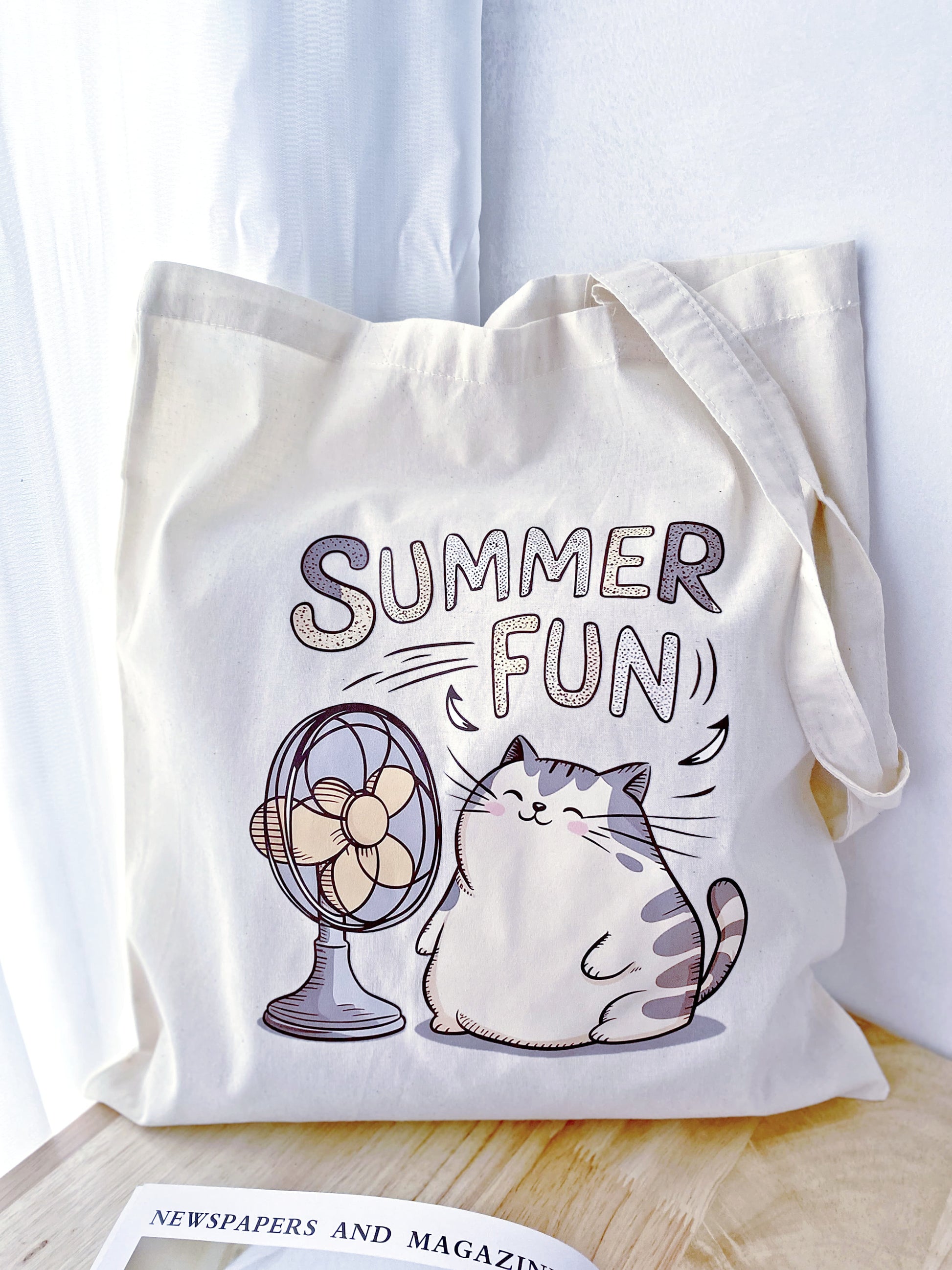 A fun cat print on a soft, large tote – perfect for a cozy weekend outing or as a thoughtful, eco-friendly gift for a friend.