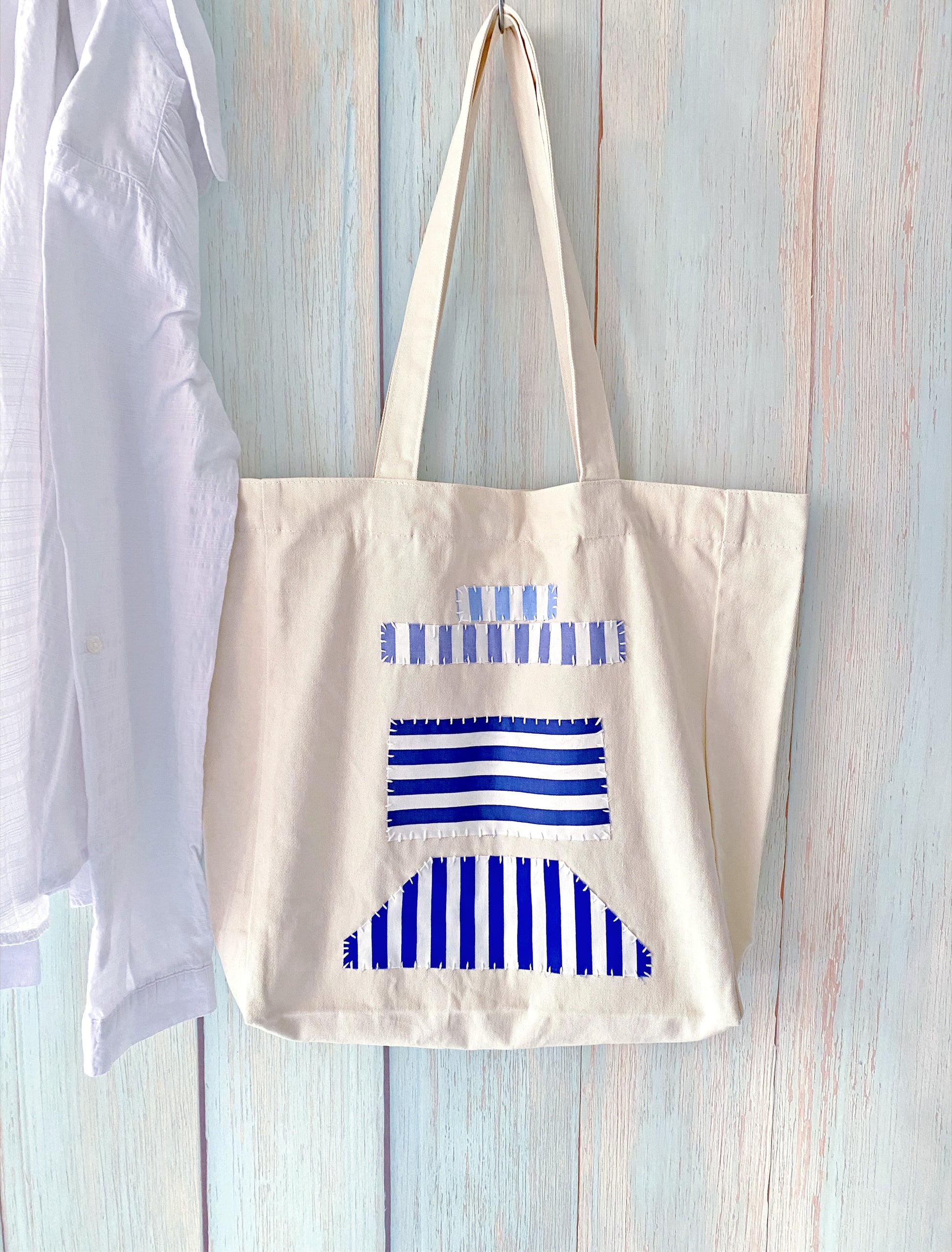 Eco-friendly cotton canvas carryall featuring artisan fabric patchwork for heartfelt holiday gifting