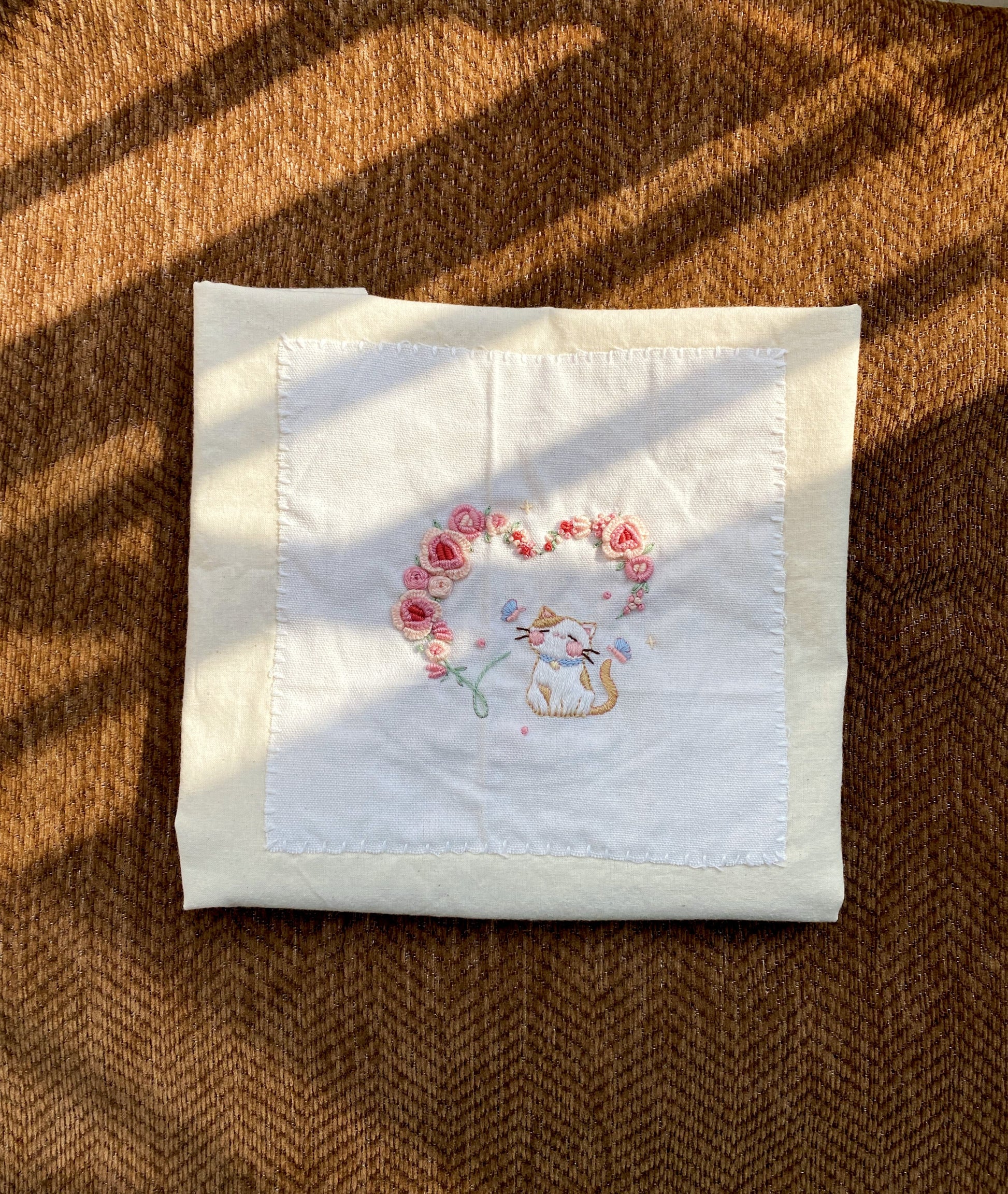 Original embroidered carry bag paired with gift wrapping for a special celebration surprise