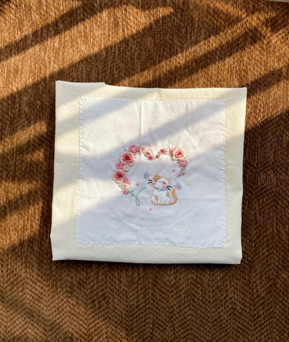 Original embroidered carry bag paired with gift wrapping for a special celebration surprise