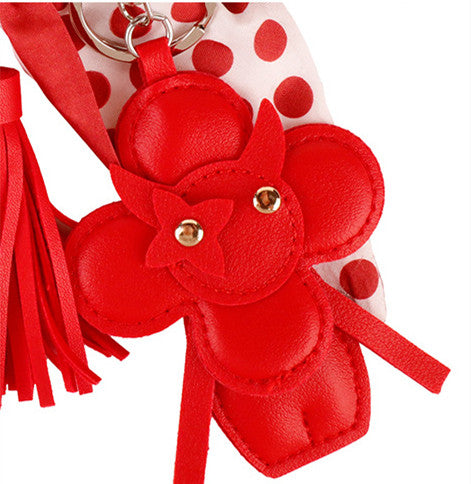 Polka dot ribbon charm with red tassels for a tote bag