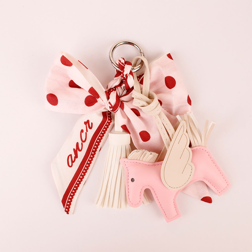 PU leather tassels on a pink handmade bag charm