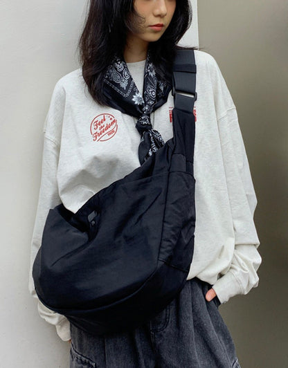 Ergonomic wide strap crossbody bag designed for shoulder weight relief