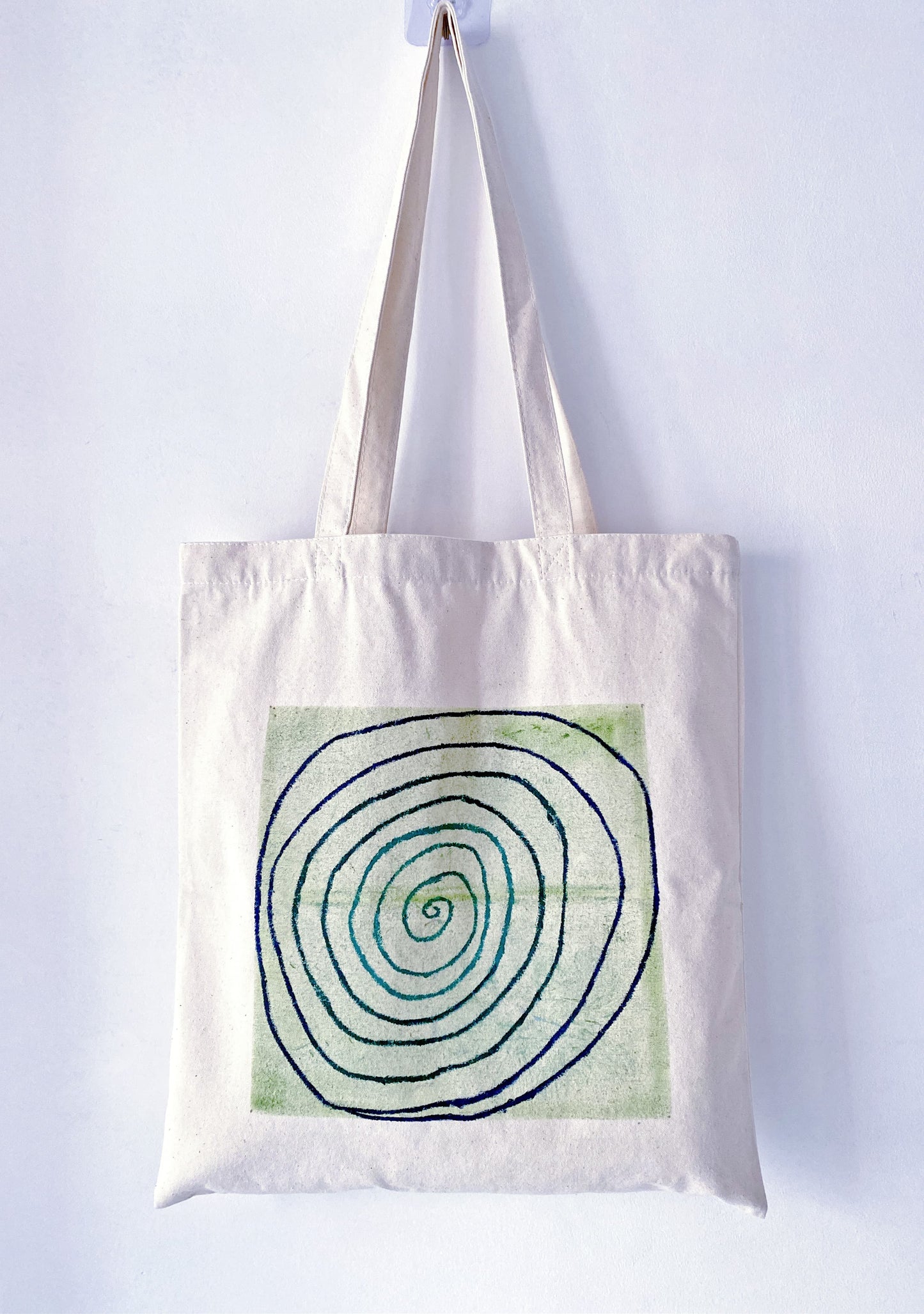 Using a high-capacity hand-painted bag to carry fresh sourdough and flowers from the market.