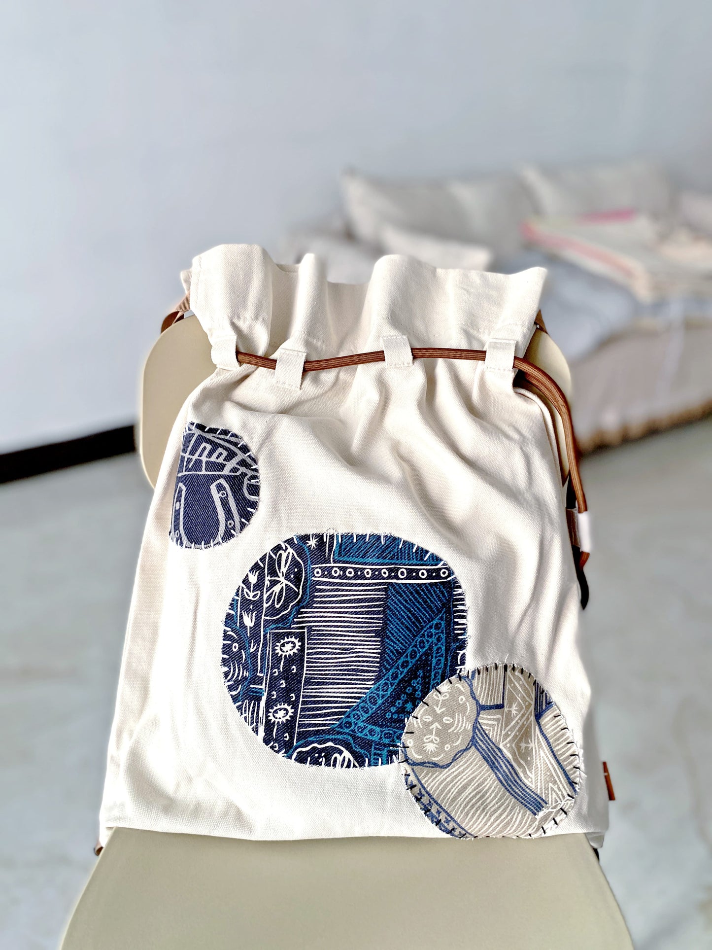 Artistic backpack casually placed on weekend market stall