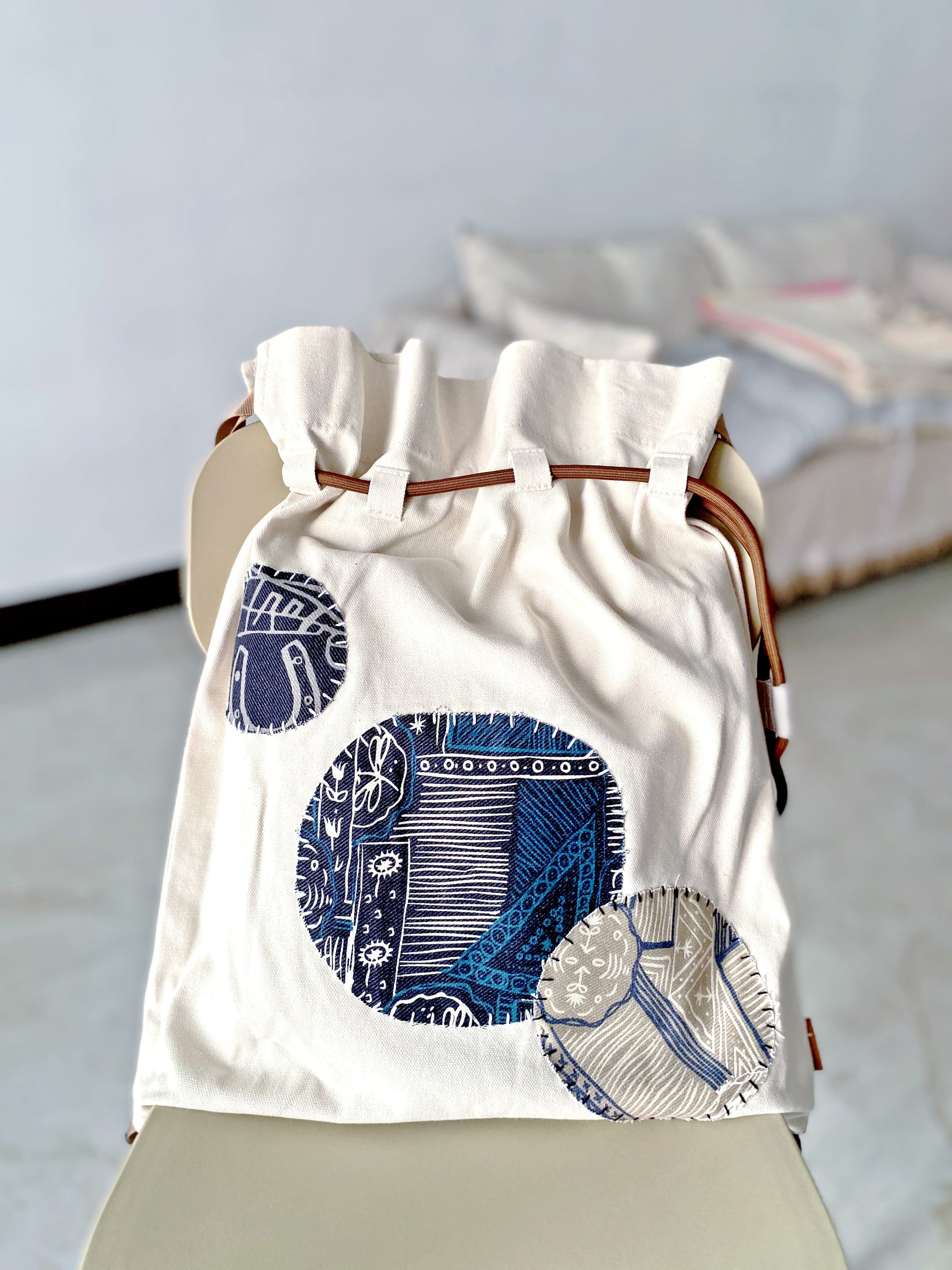 Artistic backpack casually placed on weekend market stall