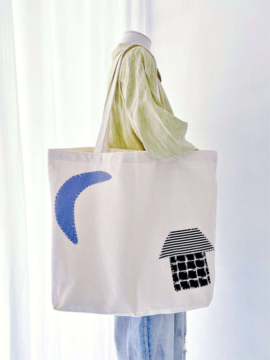 Open fabric bag filled with fresh market greens, an eco-friendly choice for plastic-free grocery shopping.