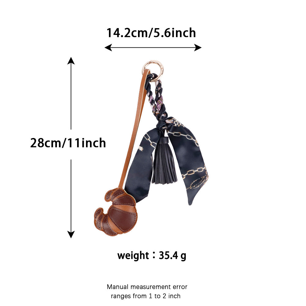 Croissant design accessory paired with a casual canvas tote