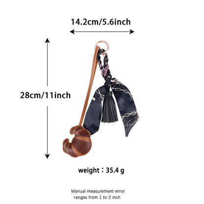Croissant design accessory paired with a casual canvas tote