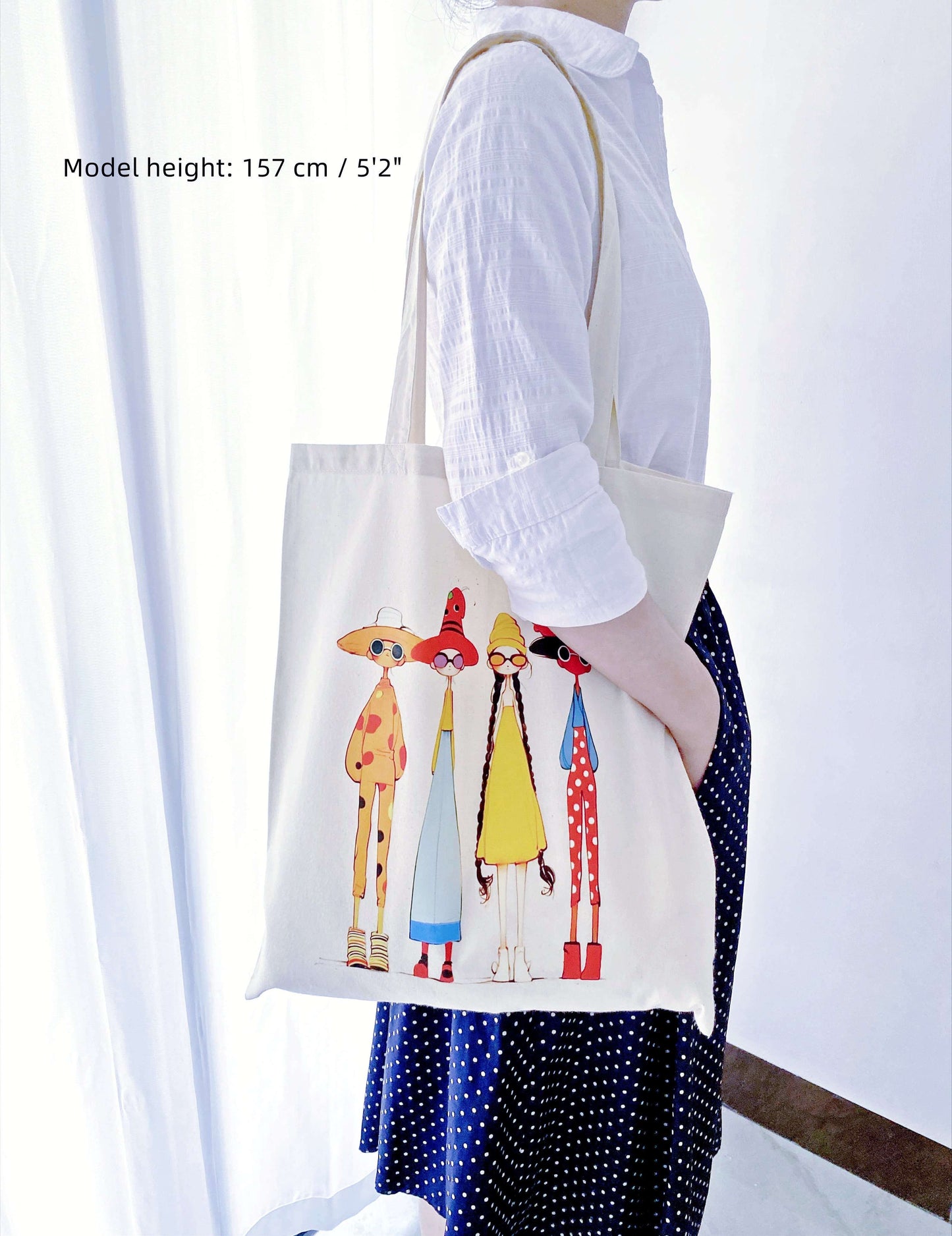 Lightweight foldable travel bag featuring hand-printed inclusive sisterhood design