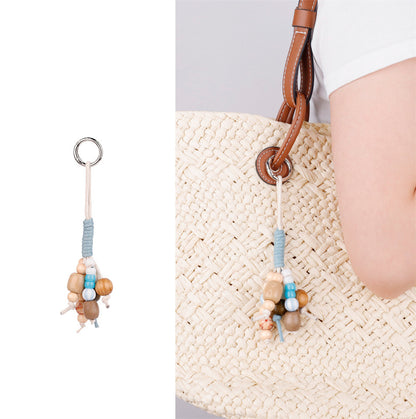Handmade stone and wood bead charm as a useful little gift