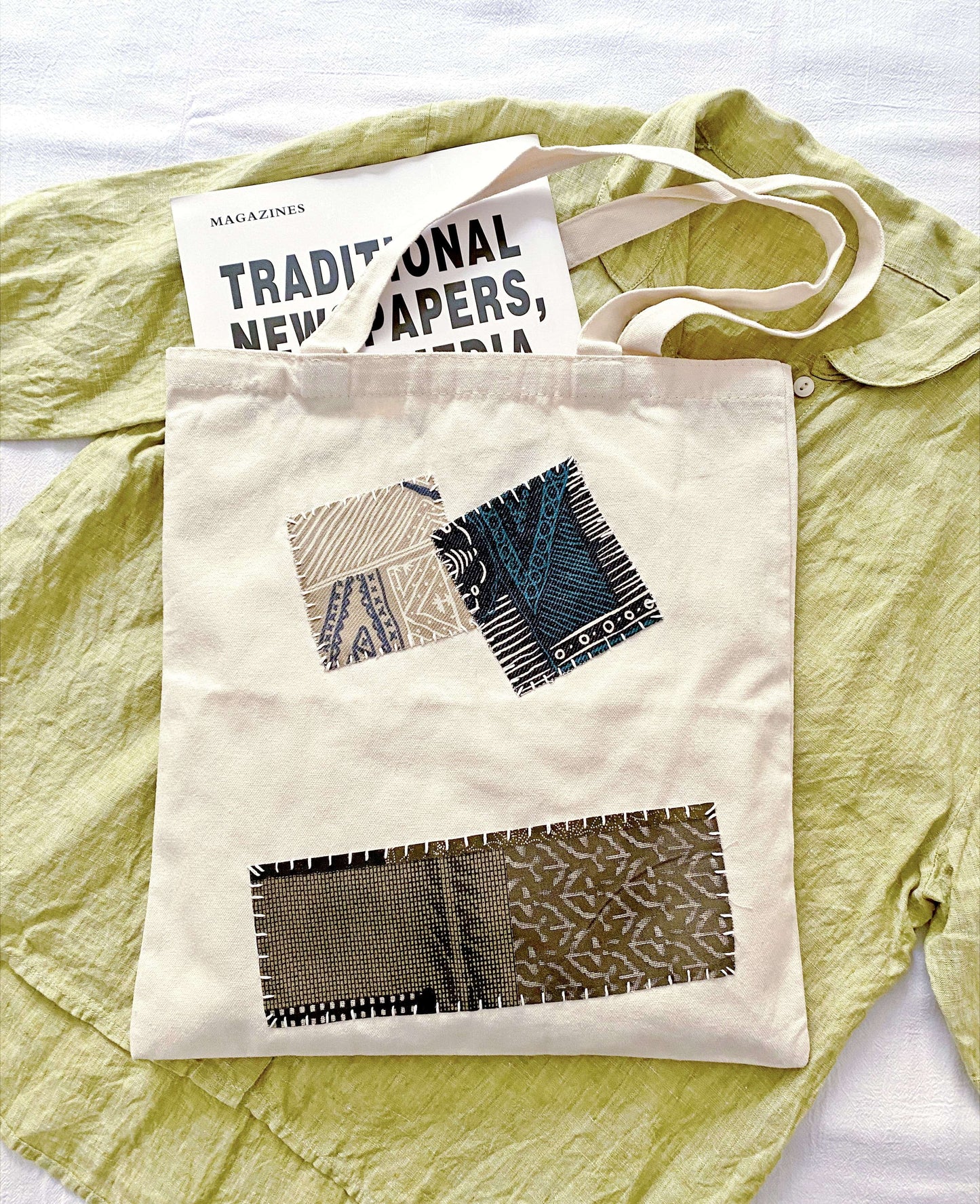 Effortless Parisian style tote bag paired with organic linen clothing for a soft aesthetic.