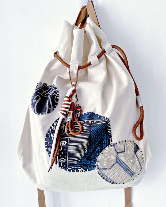 Personal-feeling women's canvas backpack for those who seek the warmth of human-made details.