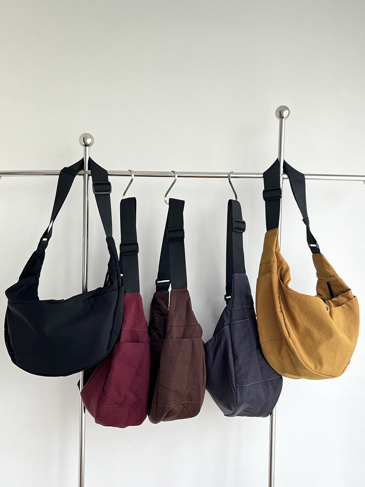 High capacity half moon bag holding wallet folding umbrella and keys