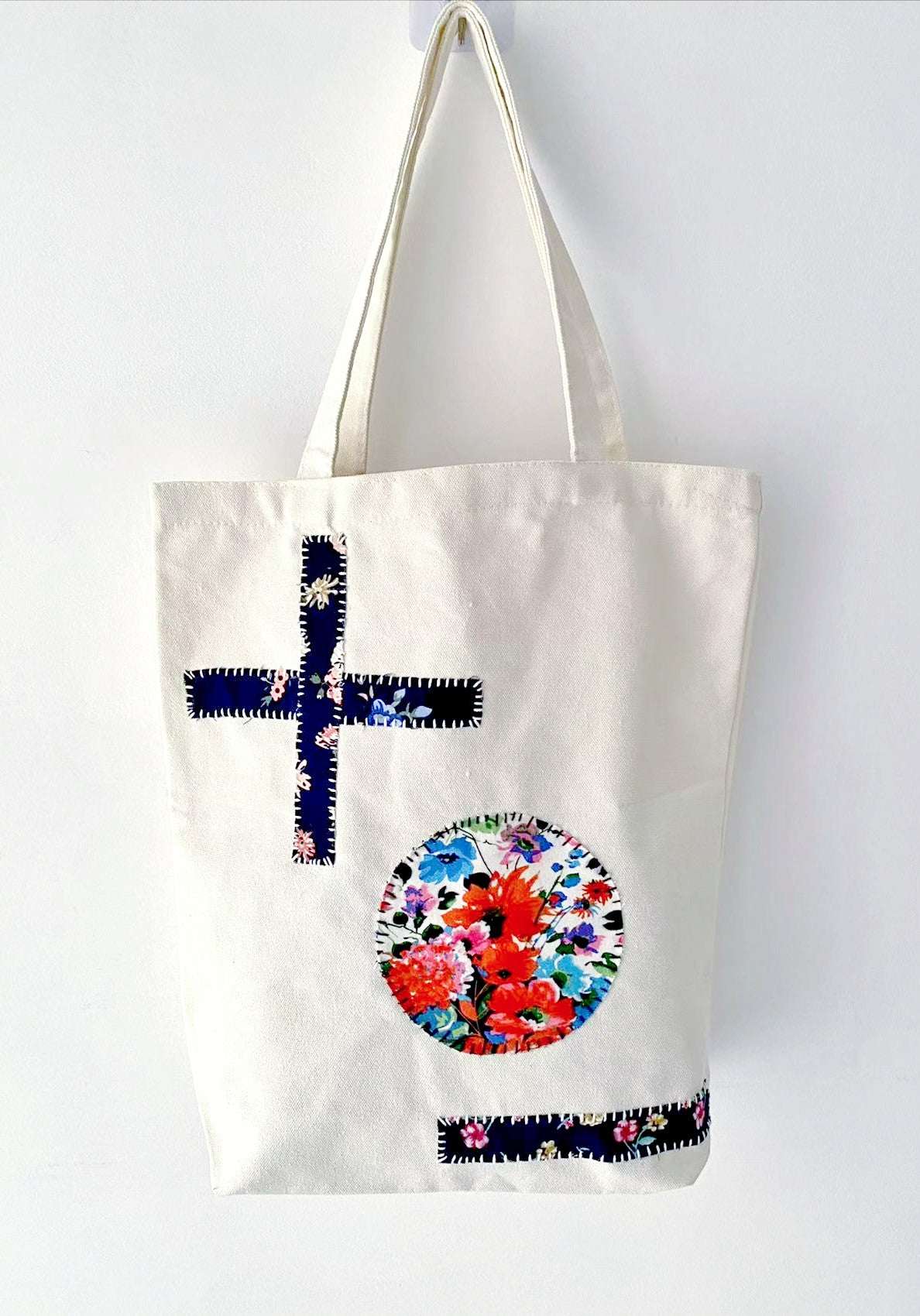 Casual canvas tote displayed with stitched fabric panels