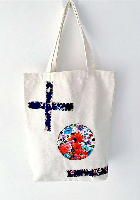 Casual canvas tote displayed with stitched fabric panels