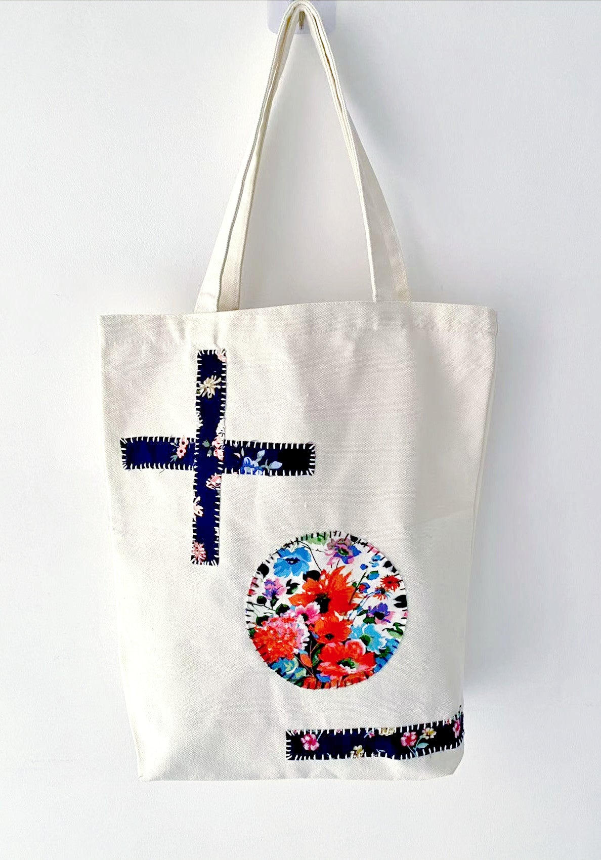 Casual canvas tote displayed with stitched fabric panels