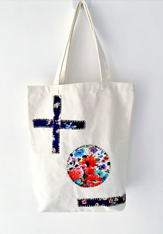 Casual canvas tote displayed with stitched fabric panels