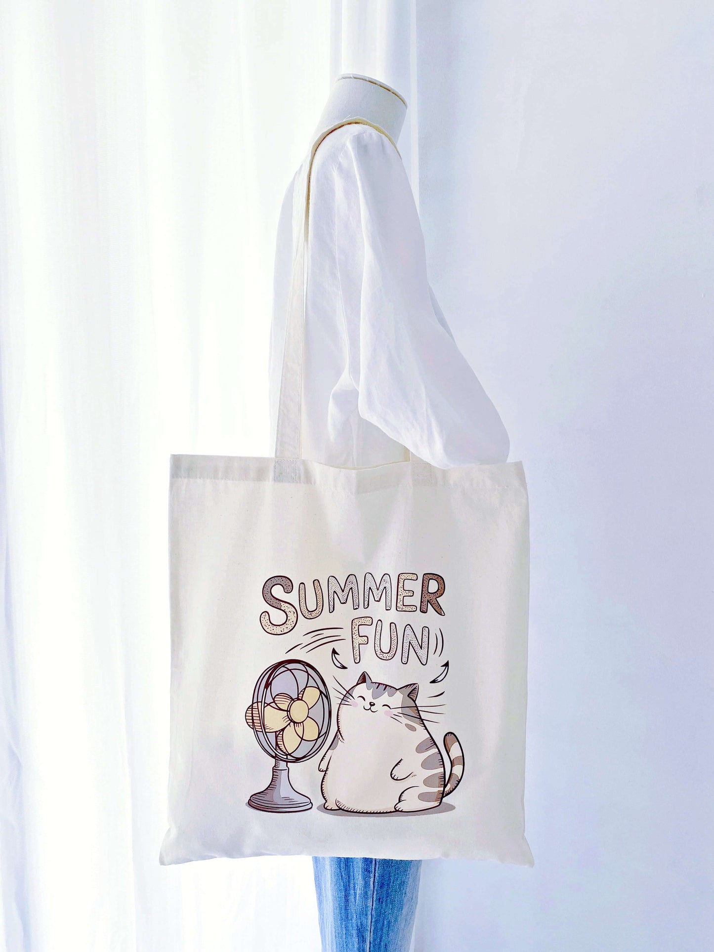 Eco-conscious tote bag featuring a hand-drawn cat, designed to brighten up your day while supporting sustainable fashion.