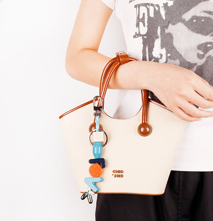 Colorful alphabet bag accessory for daily purse styling