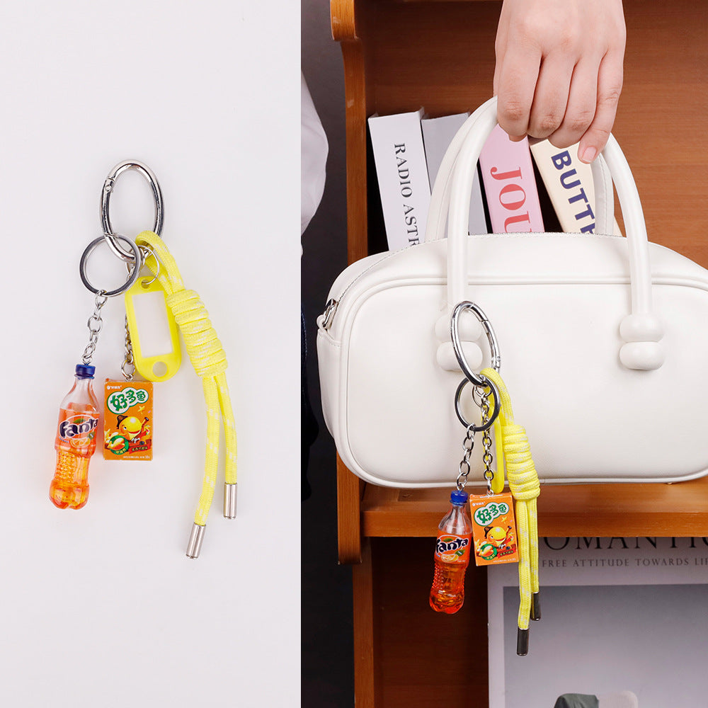 Bright handmade yellow key charm styled with casual daily outfits and denim