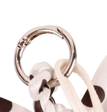 Playful animal charm with soft tassel detail