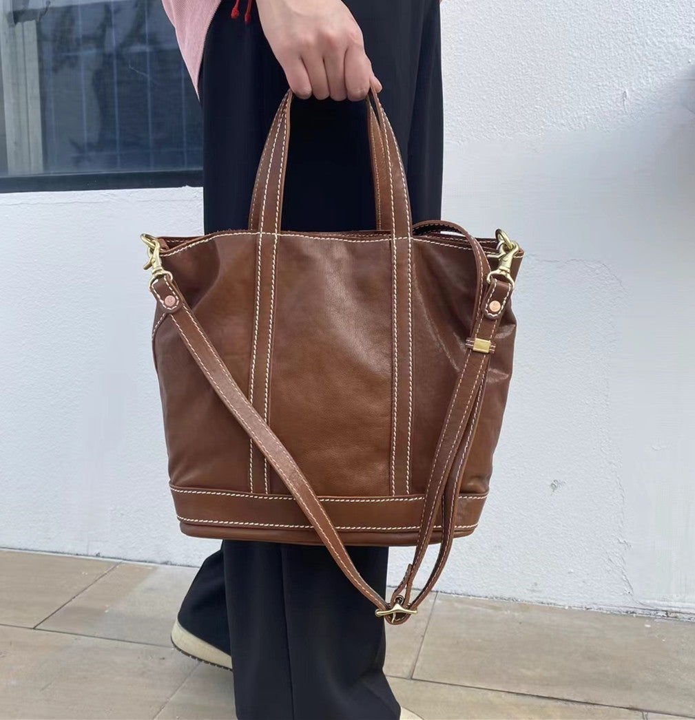 Elevate your outfit effortlessly with our Leather Top-handle Bag, designed for both style and practicality.