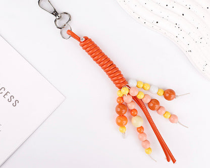 Handmade beadwork adding color to a plain handbag