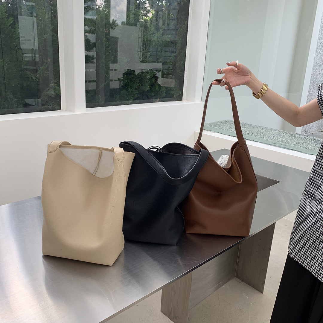 Women's drawstring handbag with inner compartment