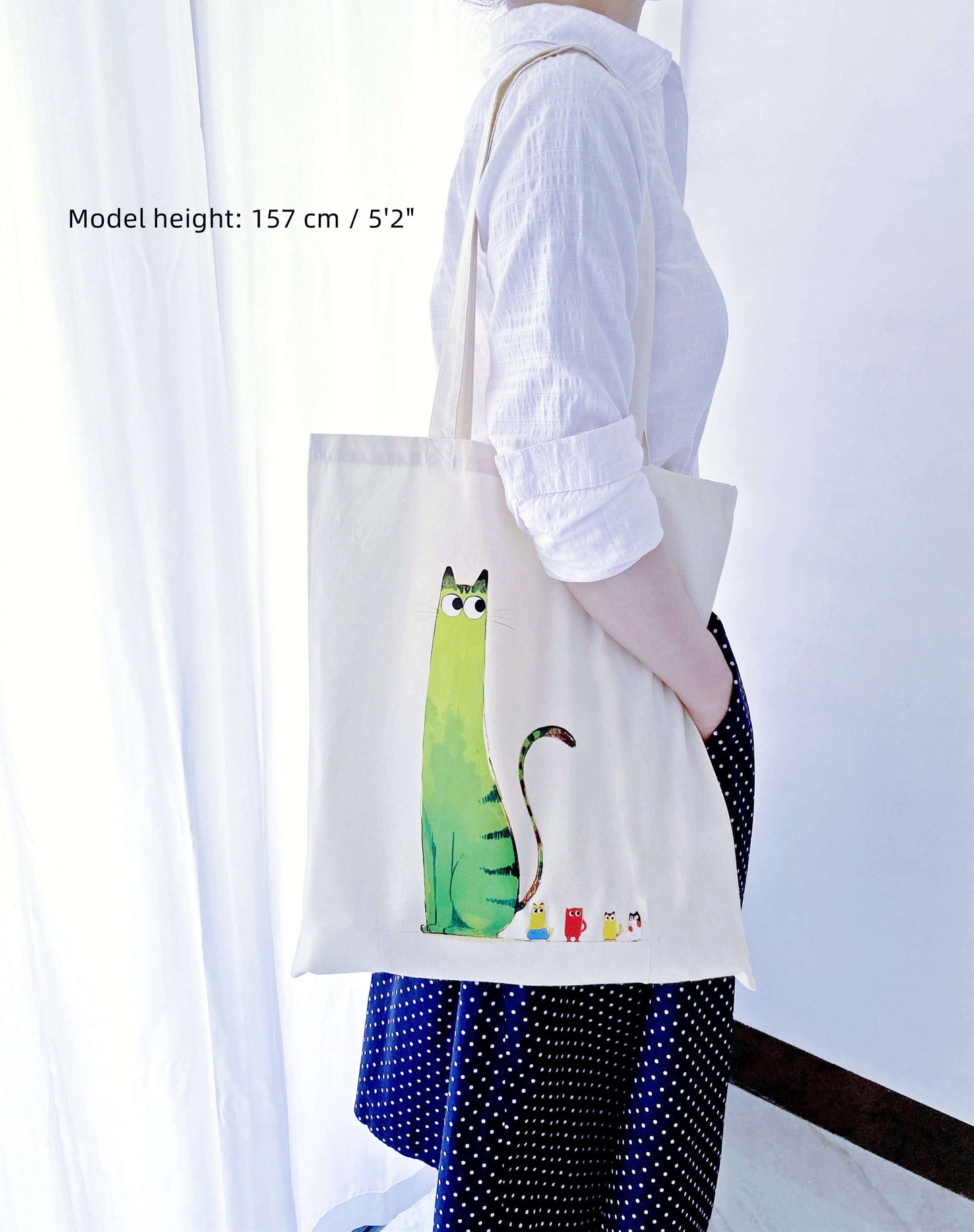 This hand-printed kitty tote is often picked by cat lovers who don’t want loud designs, just something gentle to carry every day.