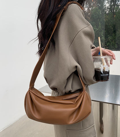 Soft wide strap crossbody bag for everyday city commute and daily errands