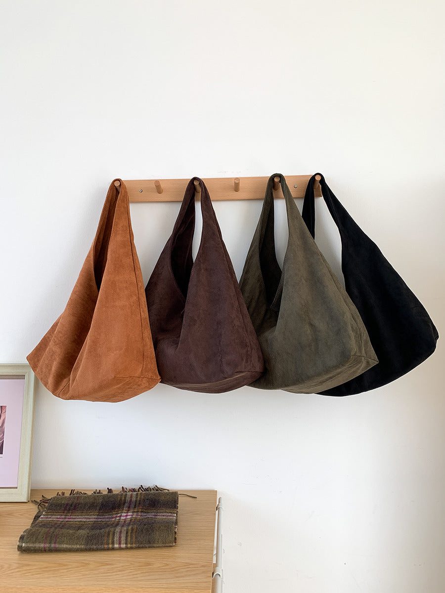 Women’s crescent handbag styled for a relaxed day in the city