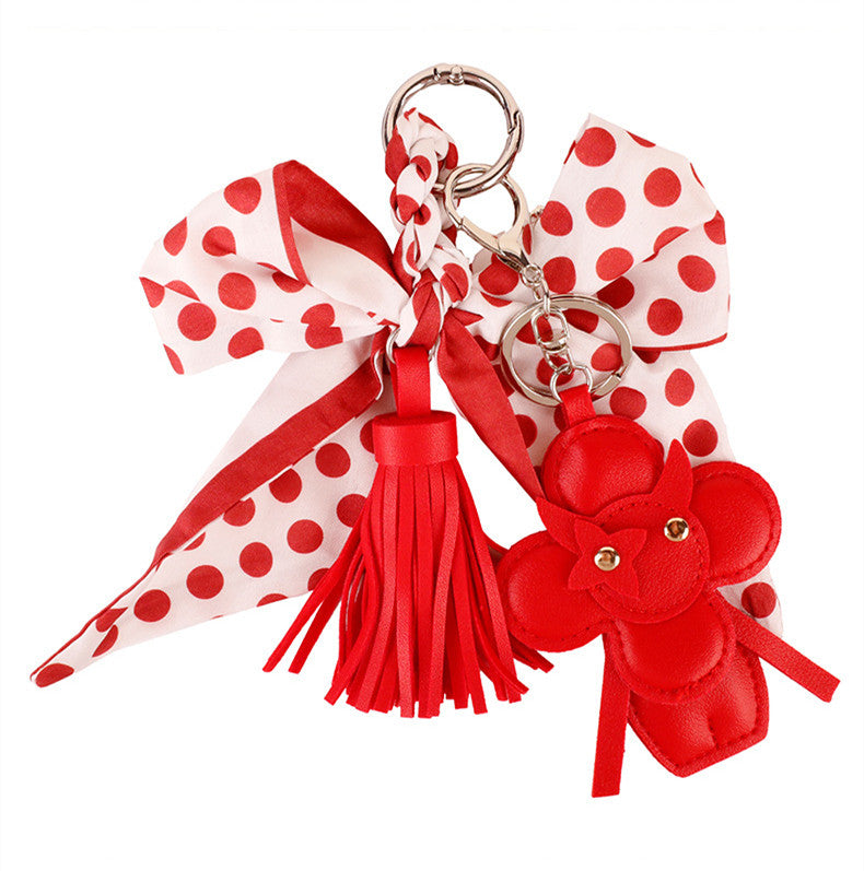 Handmade red bow keychain with dangling decorative tassels